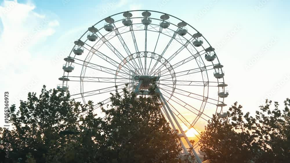 Mall of Africa turning ferris wheel in the amusement park during the golden hour