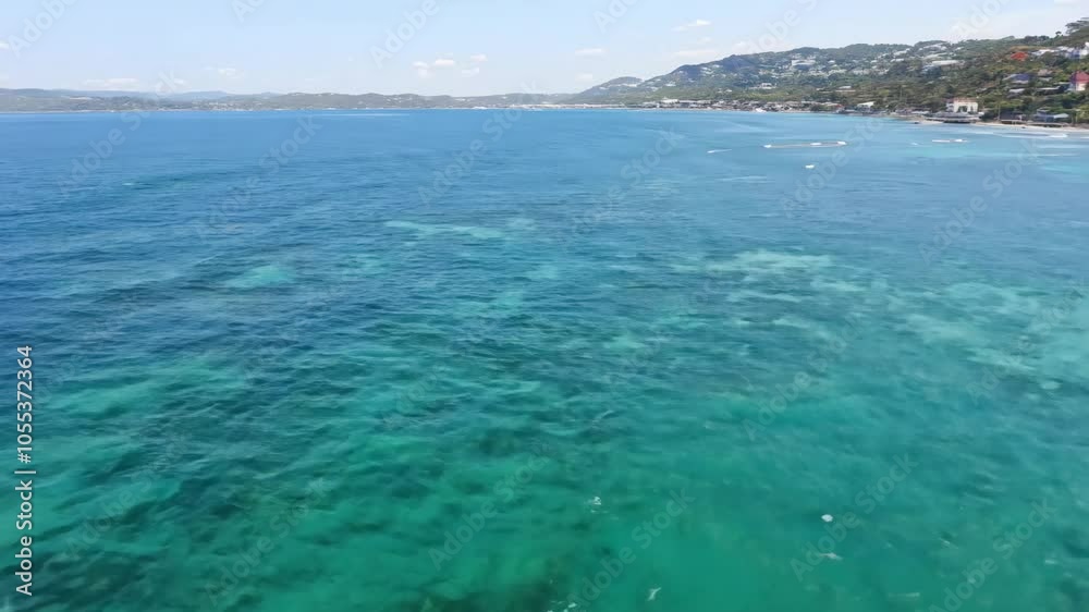 Coast: aerial view of turquoise water. Seascape: blue sky and turquoise water Coast: aerial view of turquoise water. Seascape: blue sky and turquoise water