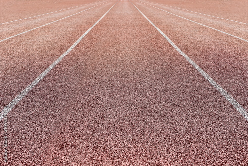 Sports surface, stadium running track. Background for motivation, striving forward. Copyspace