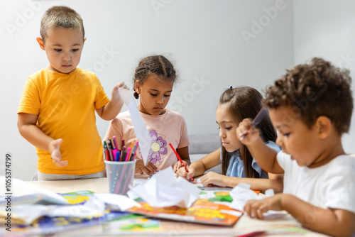 Children engaged in colorful creative arts and crafts.