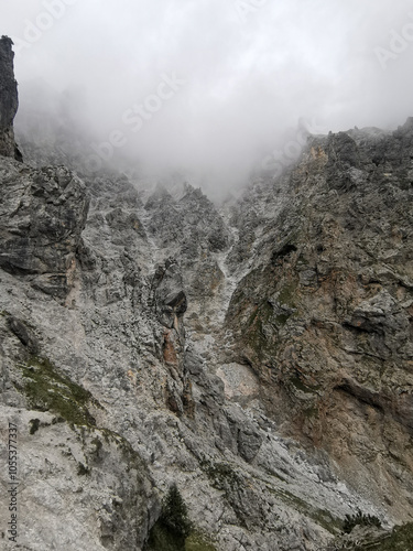 steep cliff wall in foggy weather