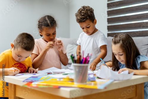 Children creating art in diverse school classroom setting.