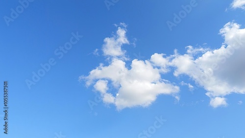 A serene blue sky with fluffy white clouds creating a peaceful and calming aesthetic, clouds, peaceful, calming