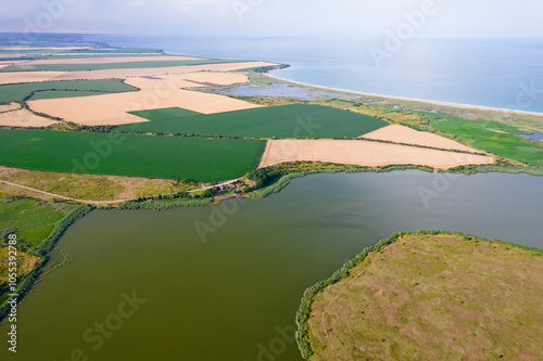 Aerial view of serene Durankulak Lake surrounded by tranquil fields and coastal wetlands, Durankulak, Bulgaria. photo