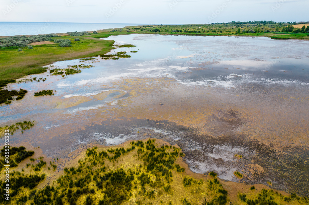 Aerial view of tranquil wetland and serene water reflecting the sky, Shablenska Tuzla, Bulgaria. Aerial view of tranquil wetland and serene water reflecting the sky, Shablenska Tuzla, Bulgaria.