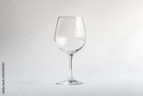 Empty glass goblet on white background