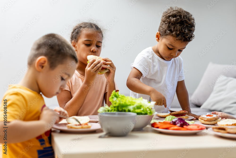 Children enjoy a healthy meal together at the table. Children enjoy a healthy meal together at the table.