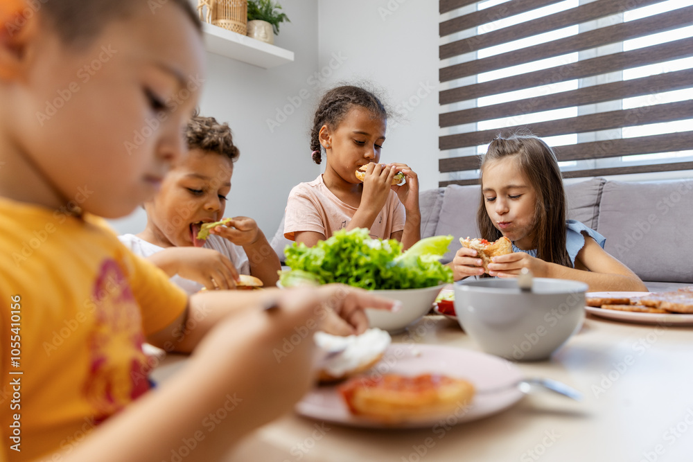 Children enjoying a meal together at home setting Children enjoying a meal together at home setting