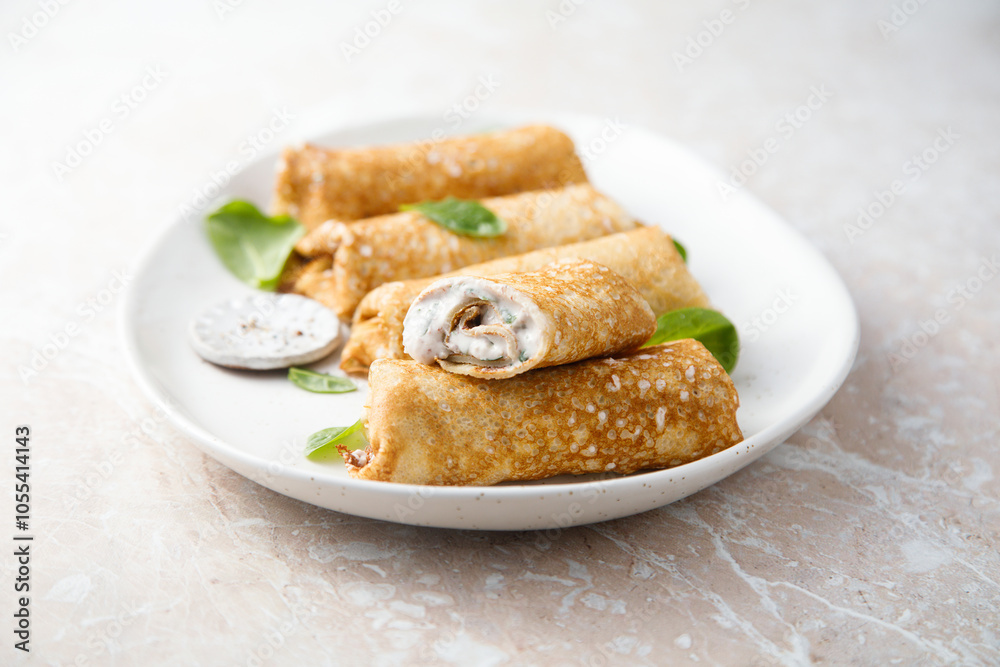 Crepes with creamy filling and raisins Crepes with creamy filling and raisins