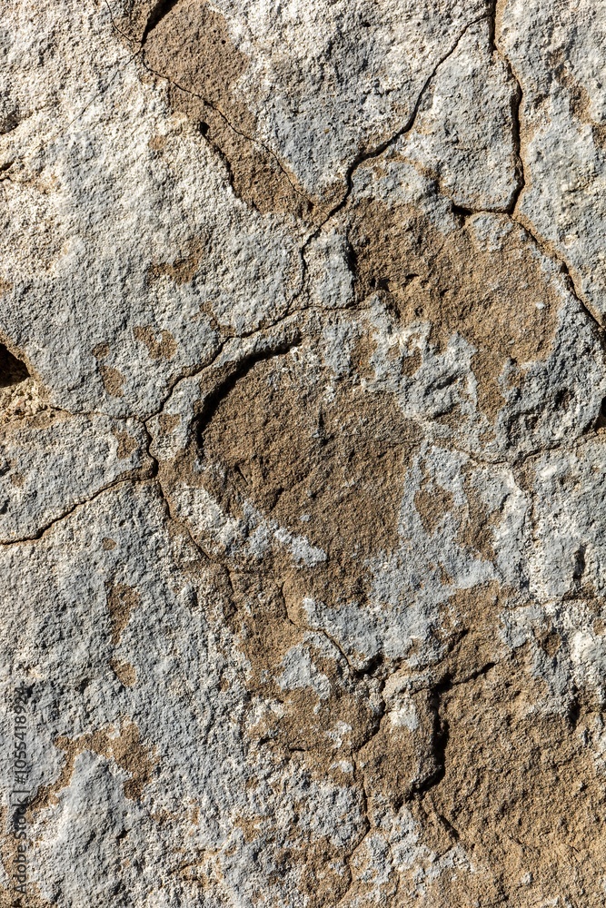 Aged concrete wall with rough weathered old surface with cracked cement in grunge style Aged concrete wall with rough weathered old surface with cracked cement in grunge style