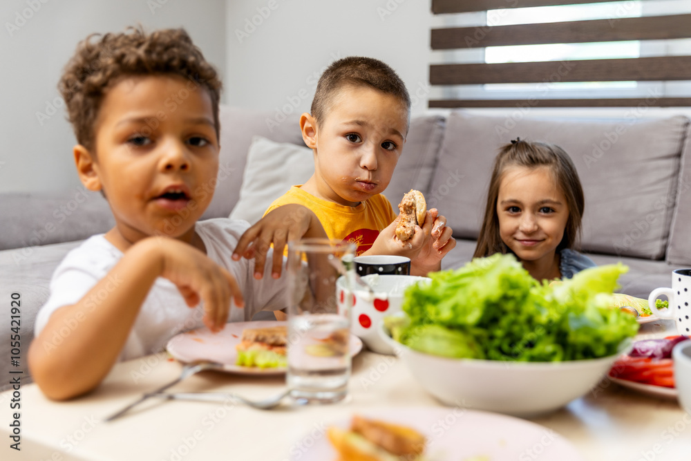 Children enjoying lunch together at a cozy table. Children enjoying lunch together at a cozy table.