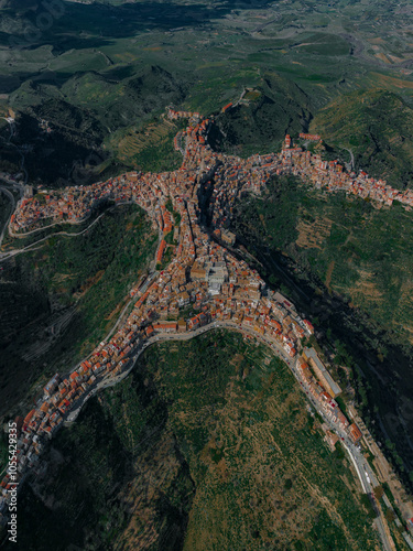 Aerial view of a beautiful village with residential homes and streets nestled in the mountains, Centuripe, Sicily, Italy. photo