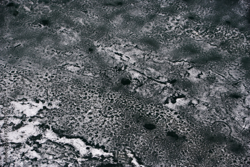 Aerial view of vast frozen landscape with patterns of snow and ice, Taymyr Peninsula, Russia.