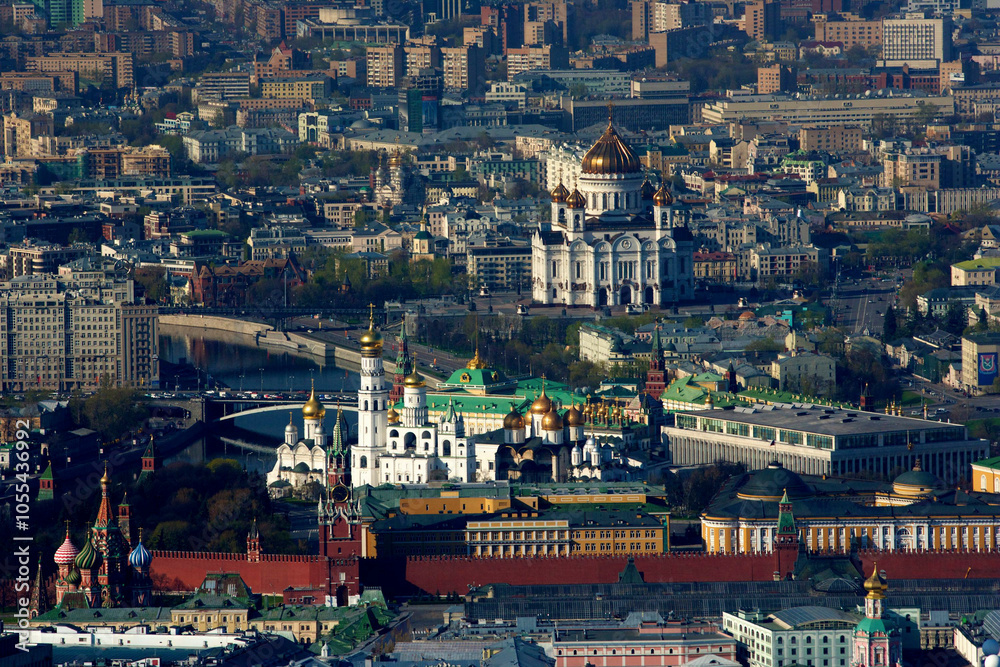 Aerial view of vibrant cityscape featuring the Kremlin and golden domes of cathedrals over a bustling urban landscape, Moscow, Russia. Aerial view of vibrant cityscape featuring the Kremlin and golden domes of cathedrals over a bustling urban landscape, Moscow, Russia.