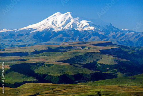 Aerial view of mount elbrus in a beautiful snowy landscape with scenic peaks and a valley, Kabardino Balkaria, Russia.