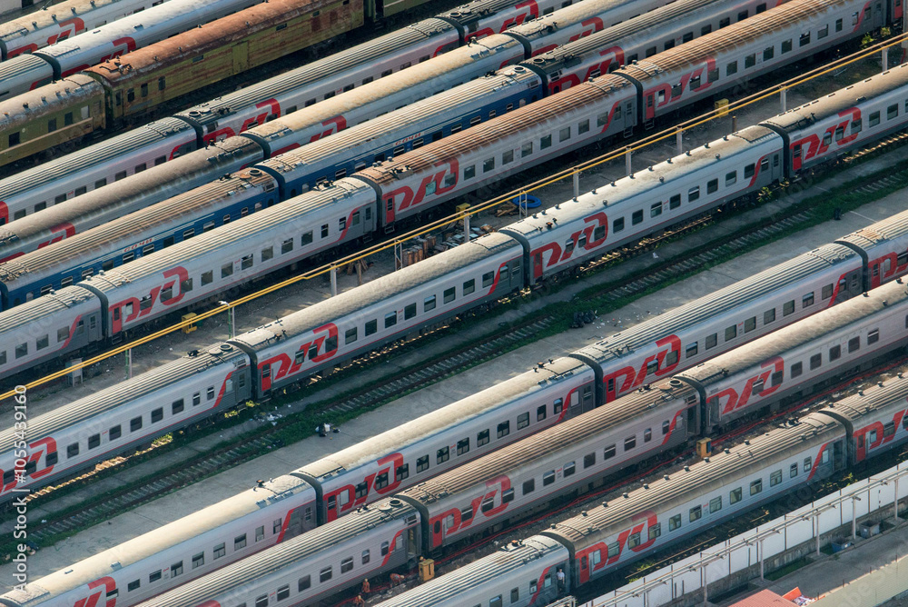 Sochi, Russia - 06 August 2014: Aerial view of modern railway infrastructure with trains and tracks in an urban setting, Sochi, Russia. Sochi, Russia - 06 August 2014: Aerial view of modern railway infrastructure with trains and tracks in an urban setting, Sochi, Russia.
