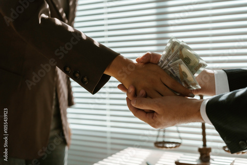Valokuva Businessman passing money to lawyer for corruption in office near justice scale,