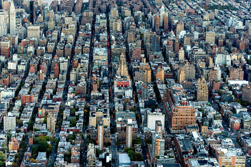 Aerial view of a bustling urban landscape with iconic skyscrapers and a dense cityscape, New York City, United States. Aerial view of a bustling urban landscape with iconic skyscrapers and a dense cityscape, New York City, United States.
