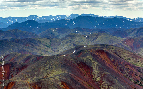 Aerial view of spoki hills with majestic mountains and a serene valley, Magadan oblast, Russia. photo