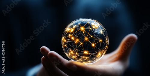 Close-up of a hand holding a glowing sphere of energy,