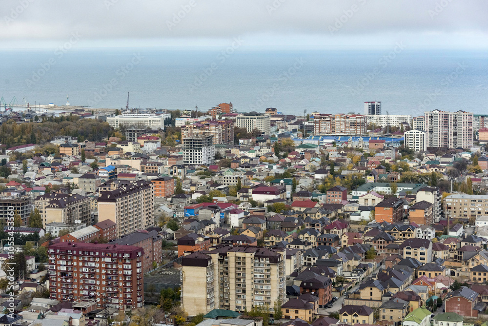 Aerial view of a beautiful coastal city with dense residential areas and modern buildings by the sea, Makhachkala, Russia. Aerial view of a beautiful coastal city with dense residential areas and modern buildings by the sea, Makhachkala, Russia.