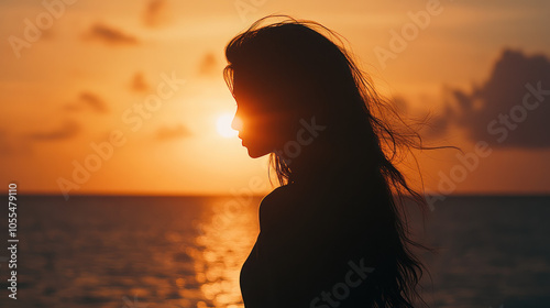 woman on the beach at sunset
