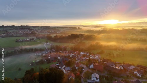 Morning Landscape in Fog, Sunrise Over Green Fields and Trees in the German Allgäu