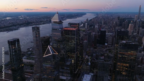 Aerial view of hudson yards skyline with modern skyscrapers and the hudson river at twilight, new york, united states.