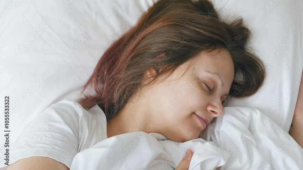 Young woman girl sleeping peacefully in bed in the morning. Close up. Young woman girl sleeping peacefully in bed in the morning. Close up.
