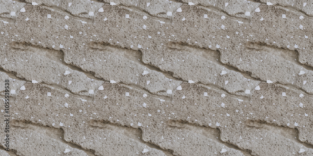 A close-up of stone with slight erosion, with scattered white flecks on a light gray base