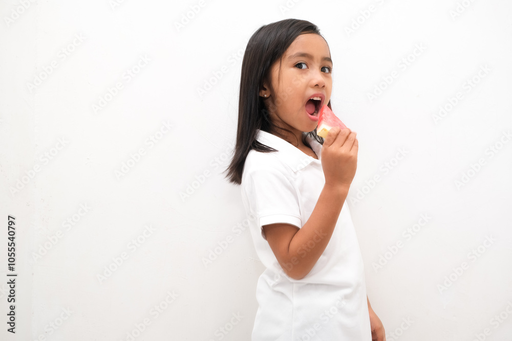Cute little Asian girl enjoying watermelon isolated on white background Cute little Asian girl enjoying watermelon isolated on white background