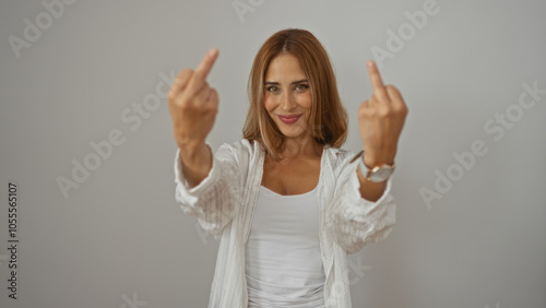 Young woman with brunette hair showing middle fingers isolated on white background