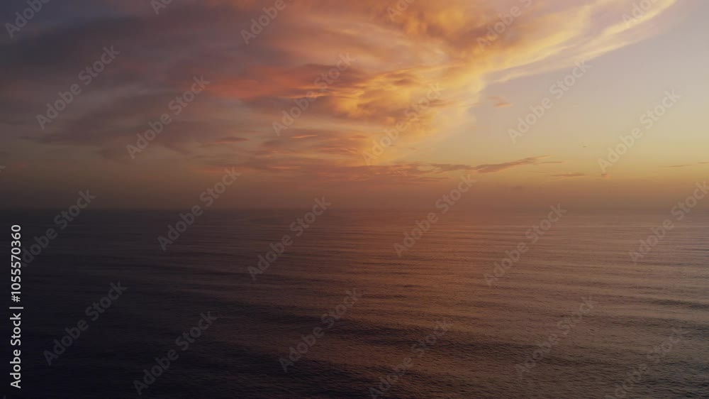 Aerial view of serene sunset over the vast Pacific Ocean with beautiful clouds and tranquil sky, Santa Monica, United States of America. Aerial view of serene sunset over the vast Pacific Ocean with beautiful clouds and tranquil sky, Santa Monica, United States of America.