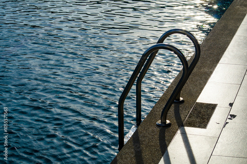 Swimming pool view in late evening in Bali. Travel and holiday concept photo