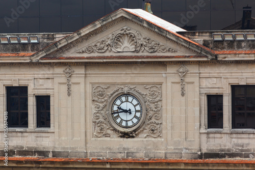 Clock on the facade of the Edificio de la Lonja del Comerciao, La Habana (Havana), Cuba photo