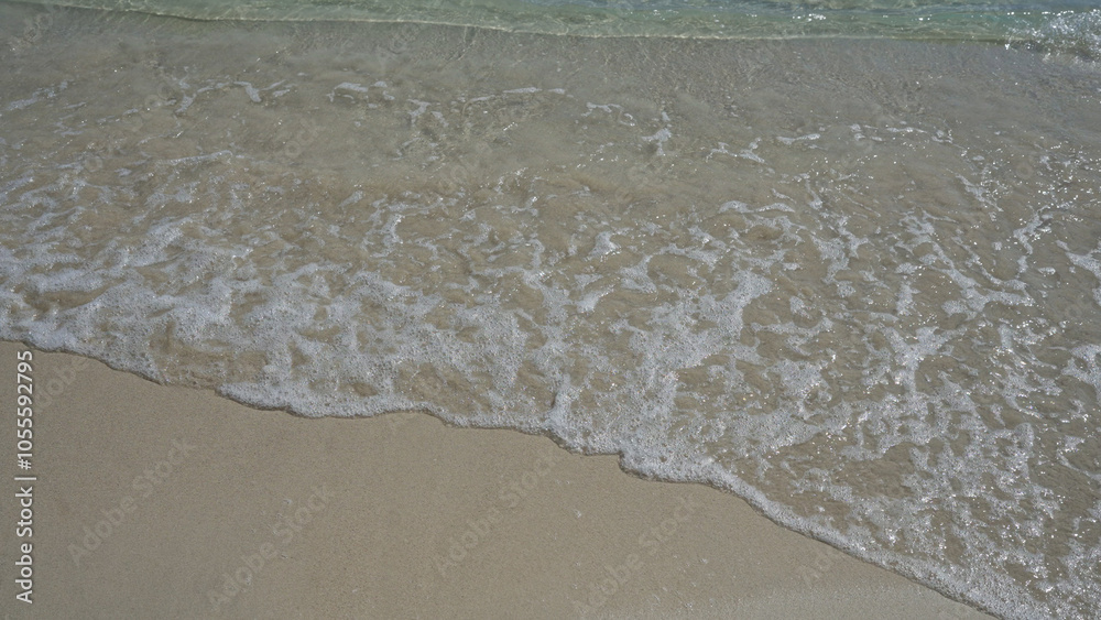 Calm, clear waves gently lap on the sandy shore of porto cesareo in salento, puglia, italy, offering a serene beach setting perfect for relaxation and summer tourism. Calm, clear waves gently lap on the sandy shore of porto cesareo in salento, puglia, italy, offering a serene beach setting perfect for relaxation and summer tourism.