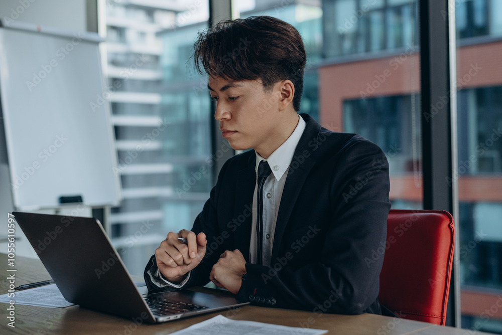 Company manager shows commitment and concentration on tasks in corporate environment Company manager shows commitment and concentration on tasks in corporate environment