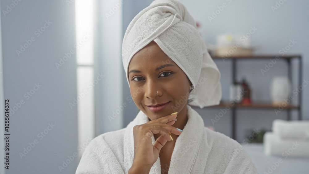 Young woman with a towel on her head smiling in a spa room, exuding beauty and relaxation. Young woman with a towel on her head smiling in a spa room, exuding beauty and relaxation.