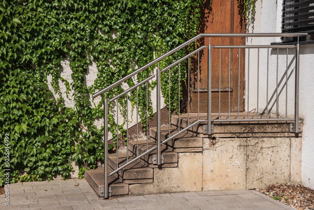 a staircase with a steel railing at an old building