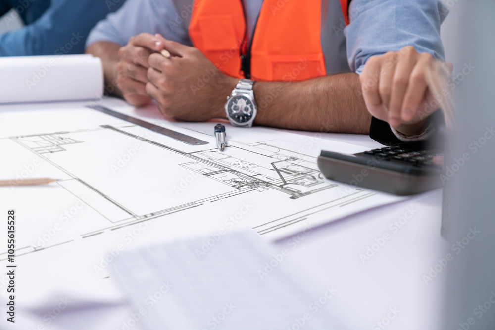 Diverse group of civil engineer and client working together on architectural project, building blueprint and calculate risk reduction for construction project at meeting table. Prudent Diverse group of civil engineer and client working together on architectural project, building blueprint and calculate risk reduction for construction project at meeting table. Prudent