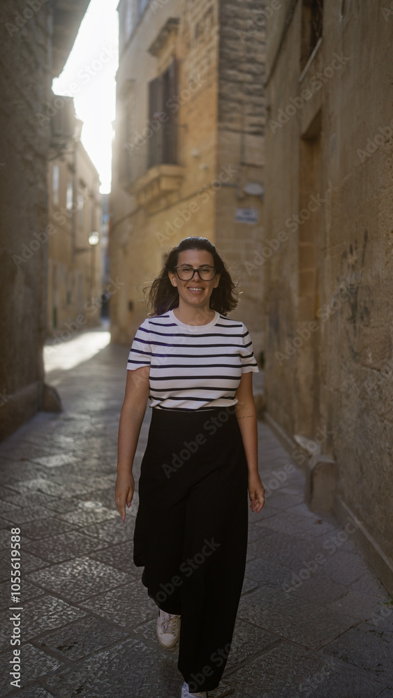 A young, hispanic woman in a striped shirt and black skirt walks down a picturesque alley in lecce, puglia, italy, showcasing historic architecture and a warm atmosphere. A young, hispanic woman in a striped shirt and black skirt walks down a picturesque alley in lecce, puglia, italy, showcasing historic architecture and a warm atmosphere.