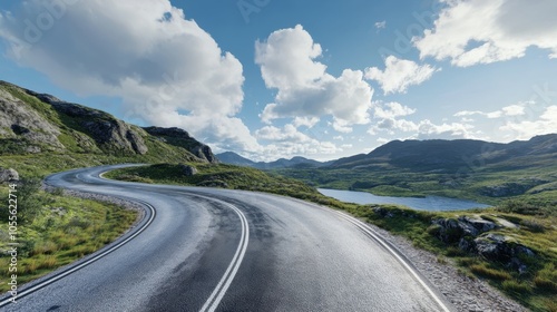 A winding road meanders through lush green hills under a bright blue sky, showcasing a tranquil natural landscape.