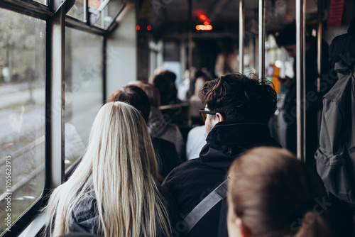 People commuting to work on a tram in the morning.