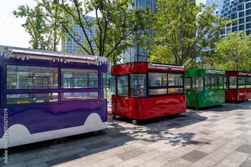 Colorful fast food trucks in the city center park