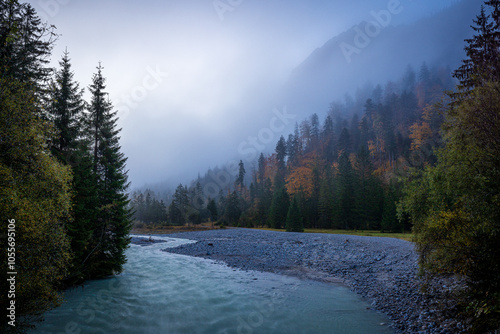 creek in mountains of karwendel in autumn at sunrise with fog photo