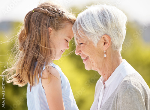 Elderly woman, child and forehead with love in park for trust, support and relationship development. Grandma, girl or outdoor with gesture with affection, care or bonding in retirement village garden