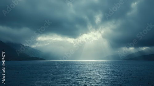 Serene Sunbeam Breaking Through Clouds Over Water