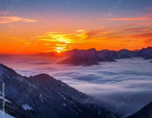 Colorful winter sunrise in the foggy mountains