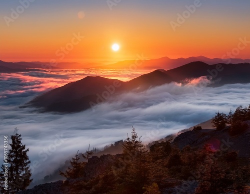 Colorful winter sunrise in the foggy mountains