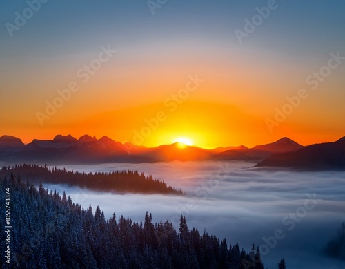 Colorful winter sunrise in the foggy mountains